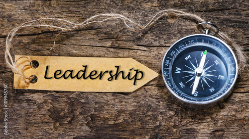 Leadership word - business tips handwriting on label with compas