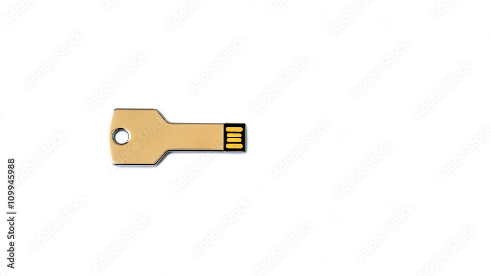 USB flash drive in key shape on white background USB flash drive in key shape on white background