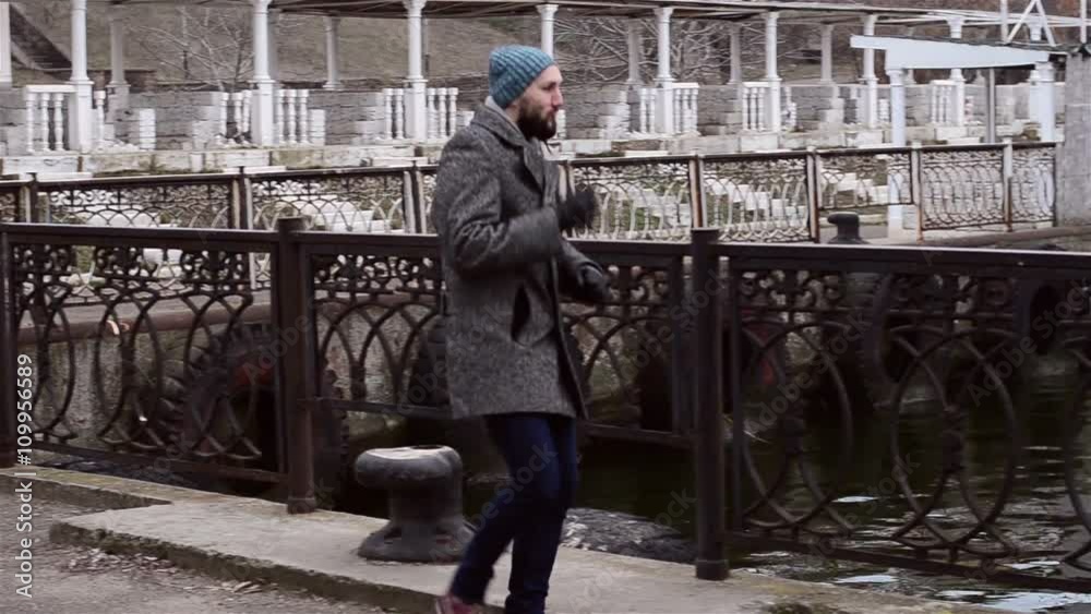 The bearded guy is dancing by the river The bearded guy is dancing by the river