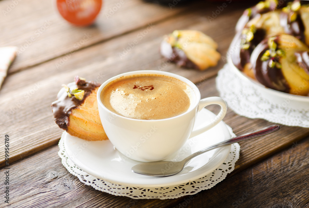 cup of coffee with homemade cookies on arustic wooden table with capsule cup of coffee with homemade cookies on arustic wooden table with capsule