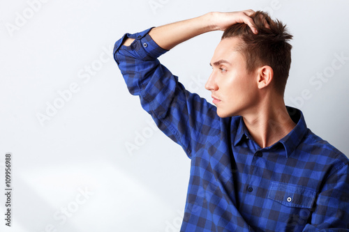 Cheerful guy worries about something