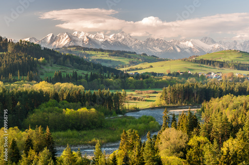 Beautiful spring panorama over Bialka river gorge and Spisz highland to snowy Tatra mountains, Poland