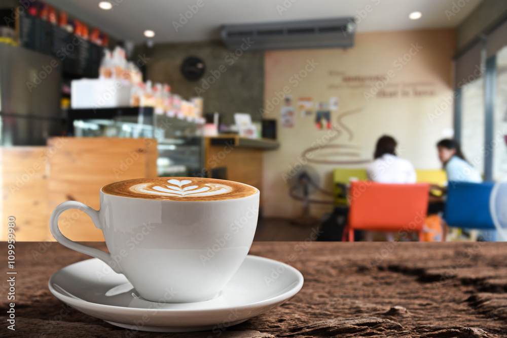 Fototapeta premium white coffee cup on wooden table