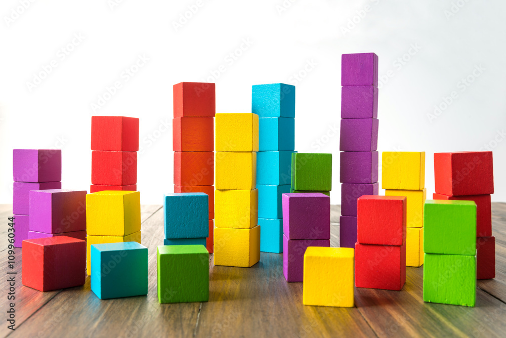 Colorful stack of wood cube building blocks Colorful stack of wood cube building blocks