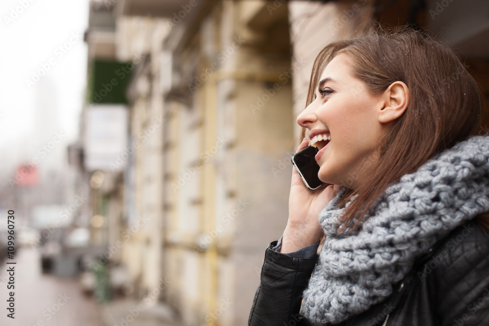 Cute young woman is communicating on telephone Cute young woman is communicating on telephone