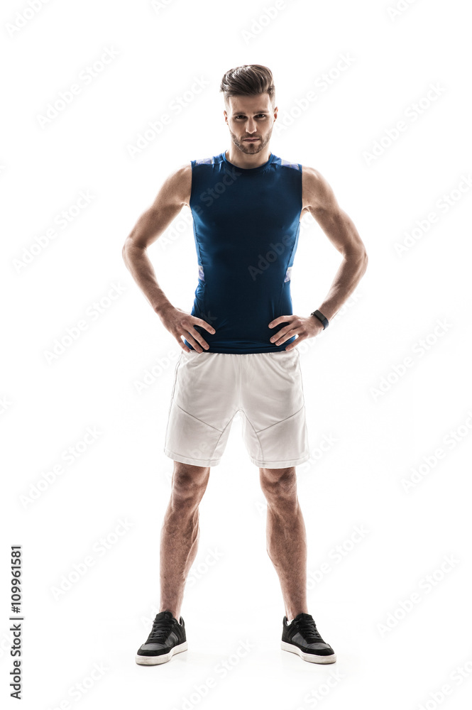 Cheerful young sportsman is showing his masculinity