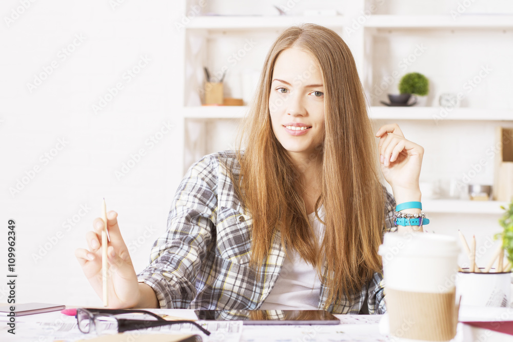 Smiling female with pencil Smiling female with pencil