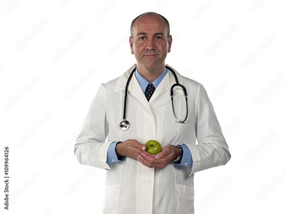 smiling mature doctor holding green apple. smiling mature doctor holding green apple.