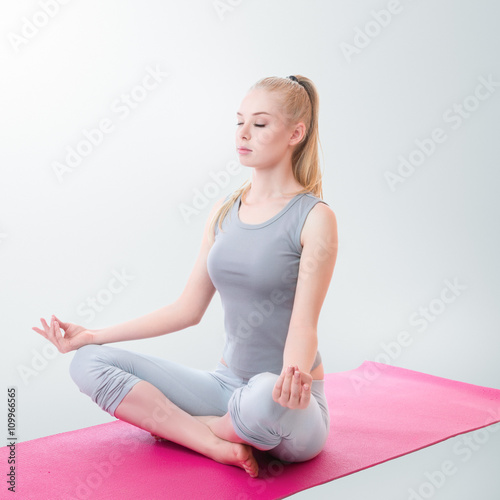 Woman meditating in lotus position