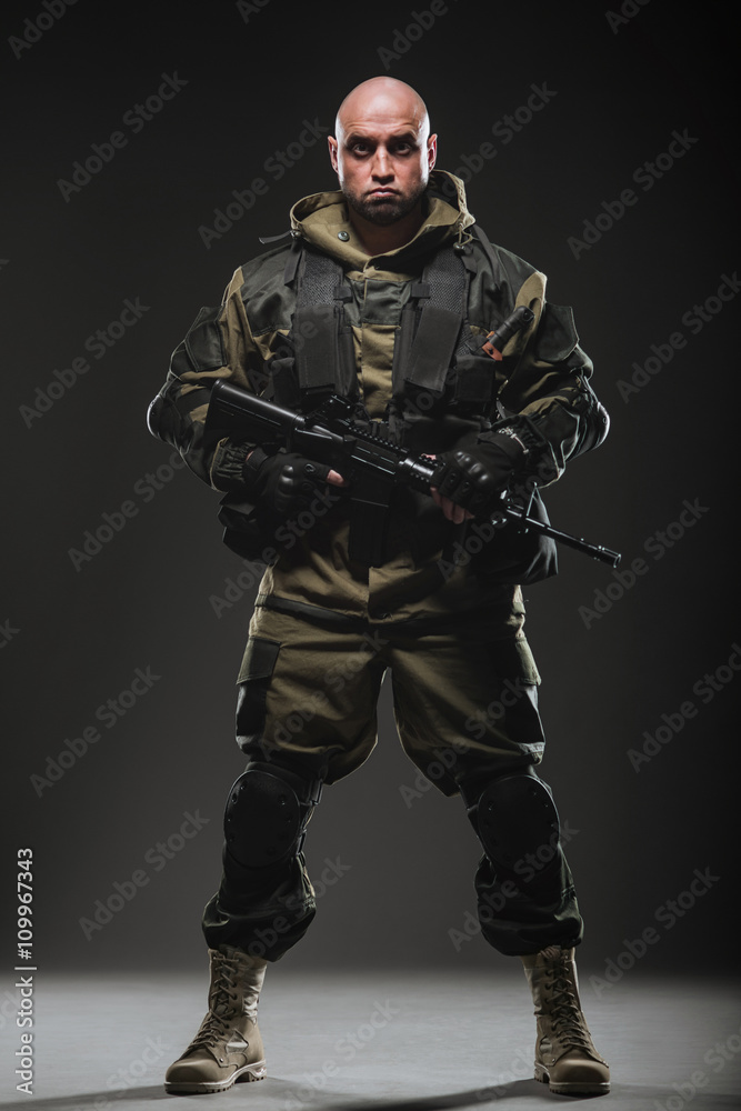 soldier man hold Machine gun on a dark background soldier man hold Machine gun on a dark background