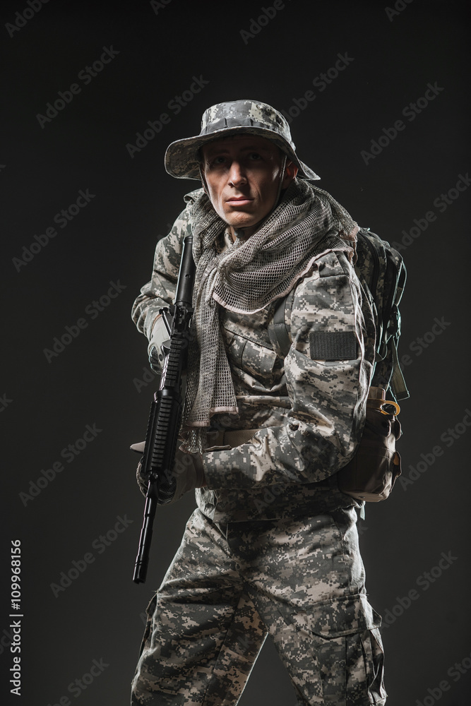 Special forces soldier man with Machine gun on a dark background Special forces soldier man with Machine gun on a dark background