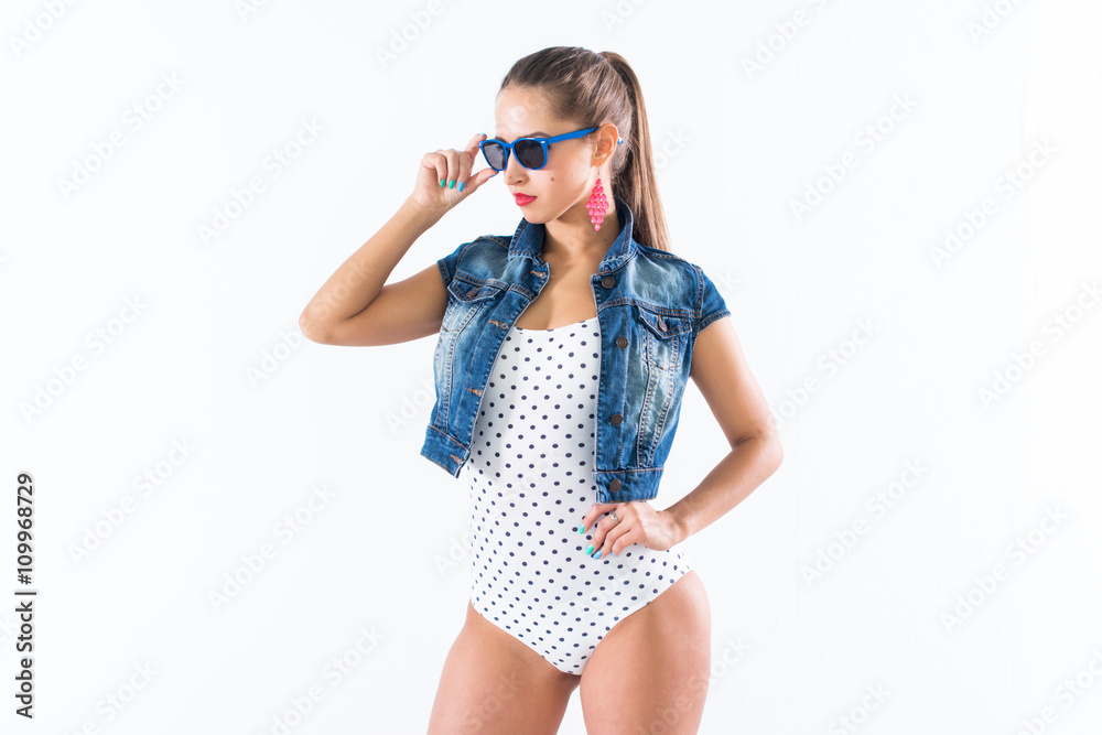 Happy beautiful girl presenting new hot summer look with accessories, looking at camera, smiling. Happy beautiful girl presenting new hot summer look with accessories, looking at camera, smiling.