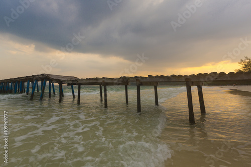 Sunset and jetty at Koh Rong island, Cambodia, South East Asia © piccaya