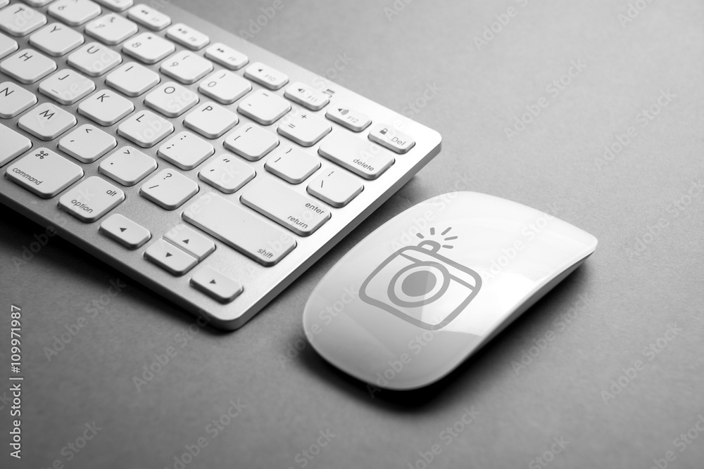 Social media icon on mouse & computer keyboard Social media icon on mouse & computer keyboard