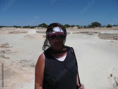 Woman with fly net protection on a Beach in Western Australia © Mr Privacy