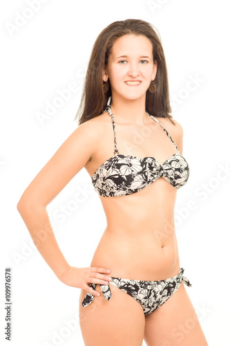 young woman in bikini poses