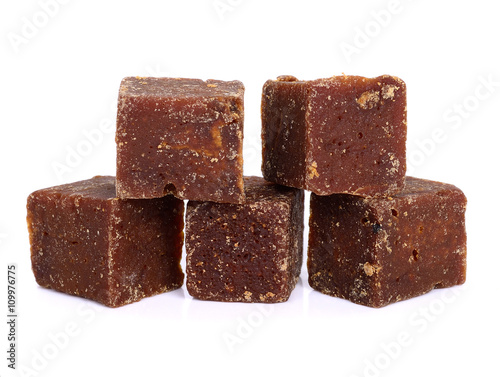 coconut flower sugar blocks on white background.