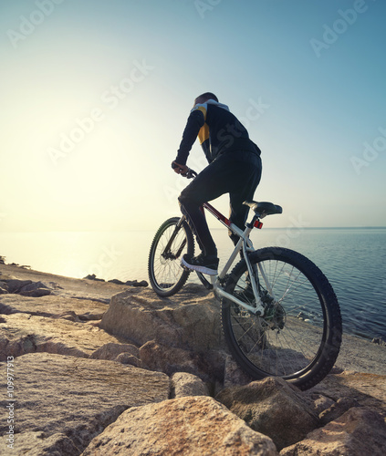 Ride on bike on the beach. Sport and active life concept.