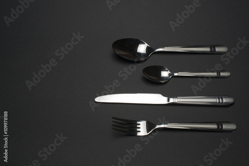 cutlery on dark table photo