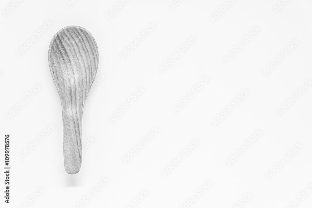 Black and white view of Classic wooden spoon with white background and selective focus Black and white view of Classic wooden spoon with white background and selective focus