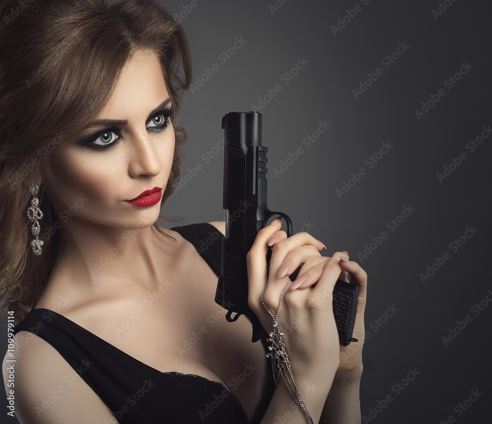 Sexy beauty young woman with gun close up portrait Sexy beauty young woman with gun close up portrait