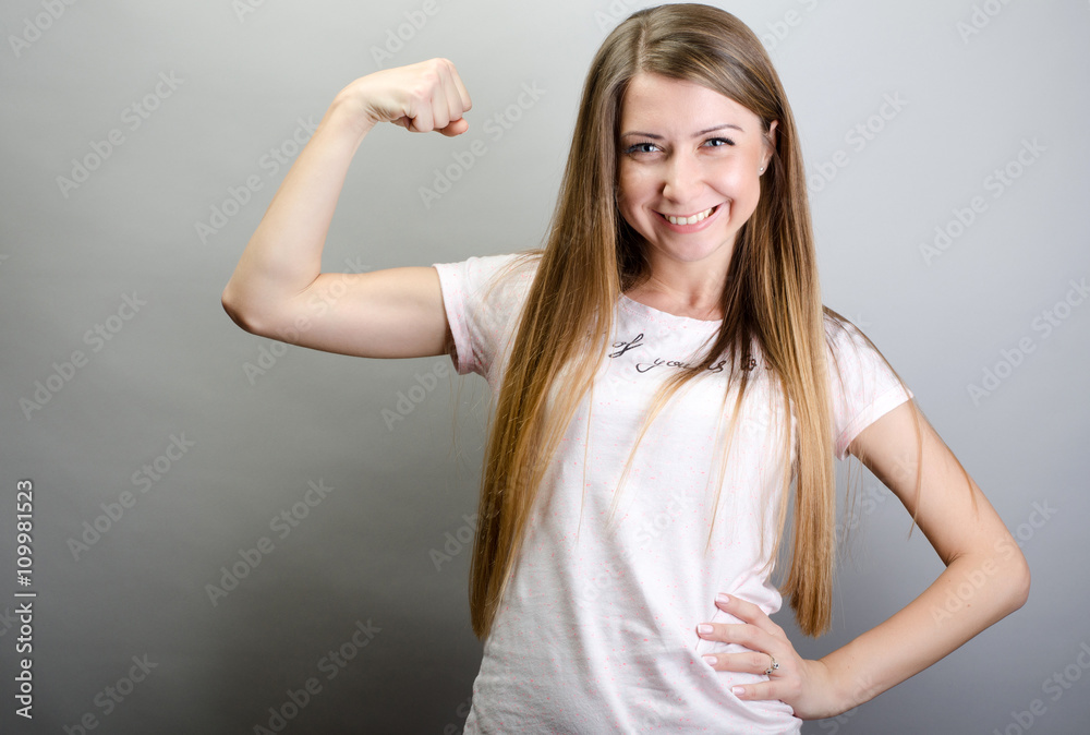 girl showing muscles