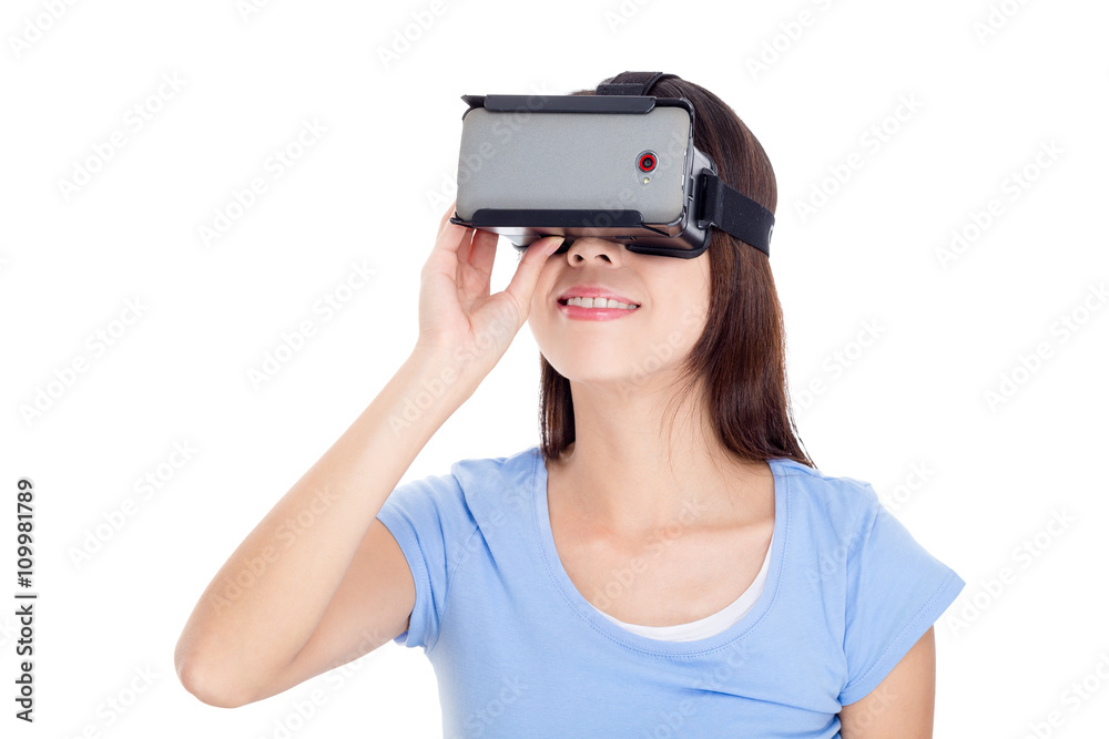 Woman looking though virtual reality goggle Woman looking though virtual reality goggle