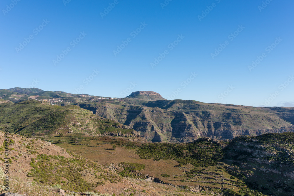 View to the tableland La Fortaleza and the mountain village Chipude situated In the highlands of La Gomera on the Canary archipelago. La Fortaleza is famous and one of the big landmarks on the Island