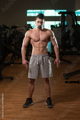 Young Bodybuilder Posing In The Gym