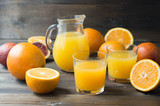 Fresh orange juice in a glasses and jug