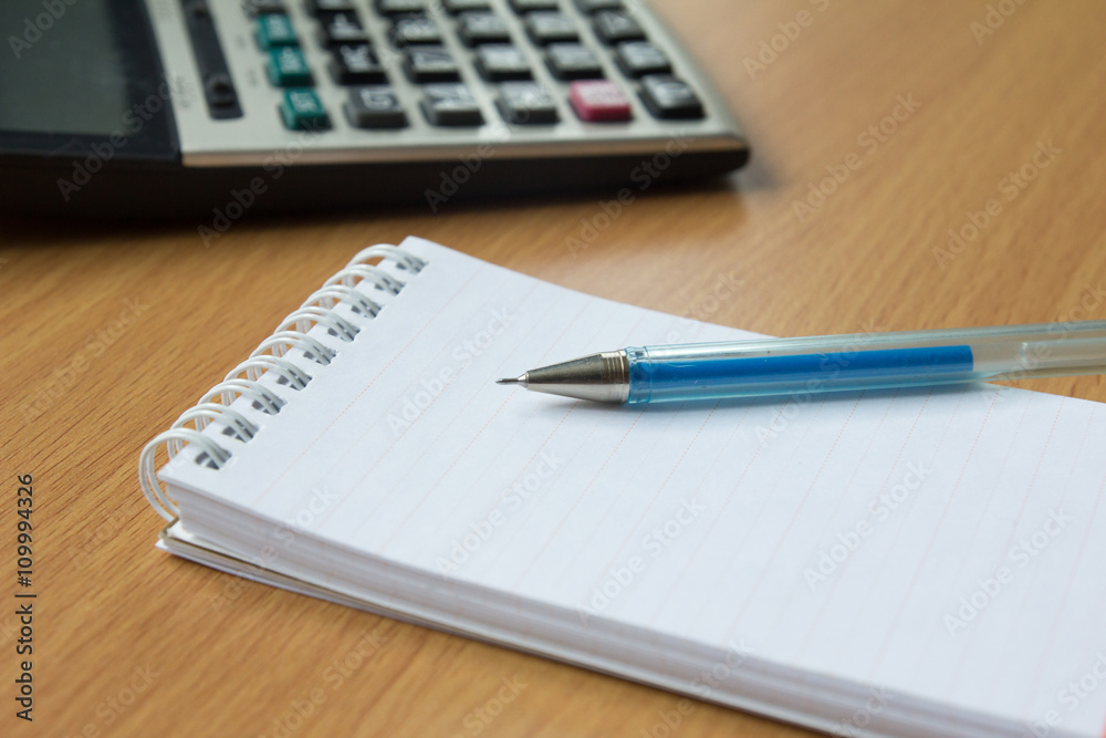 Calculator, notebook and pen Calculator, notebook and pen
