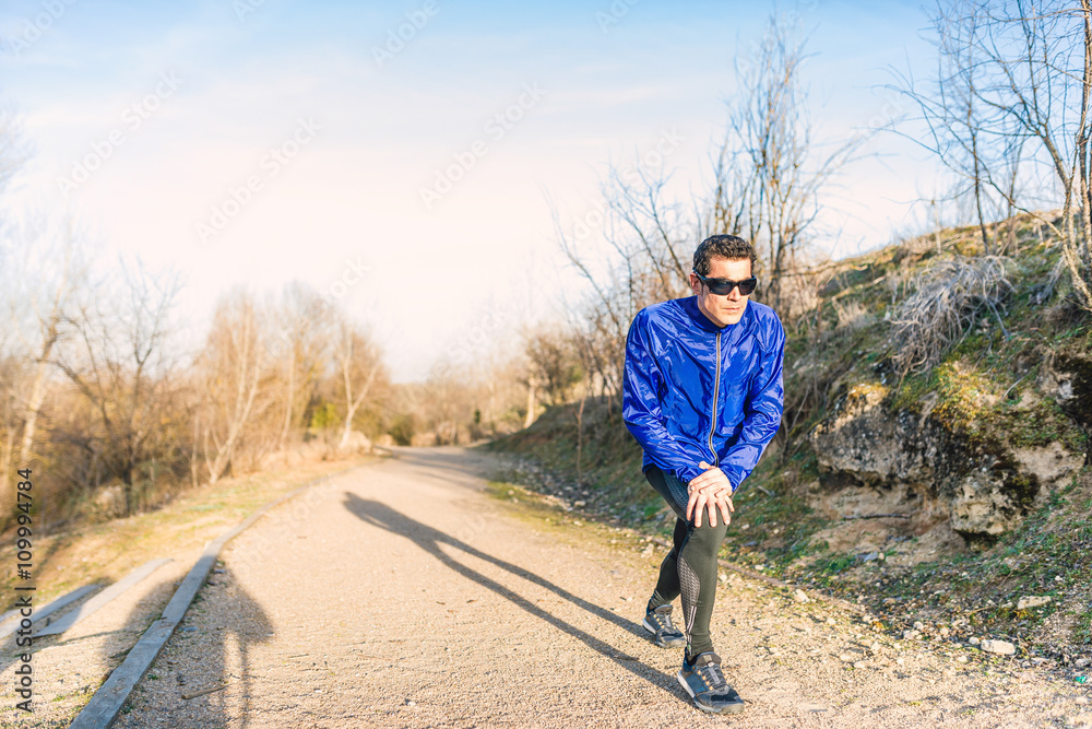 Man running in a promenade outdoors. Man is training