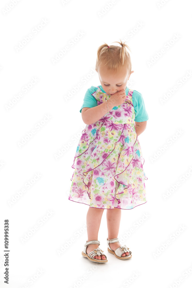 Shy toddler girl in summer dress Shy toddler girl in summer dress