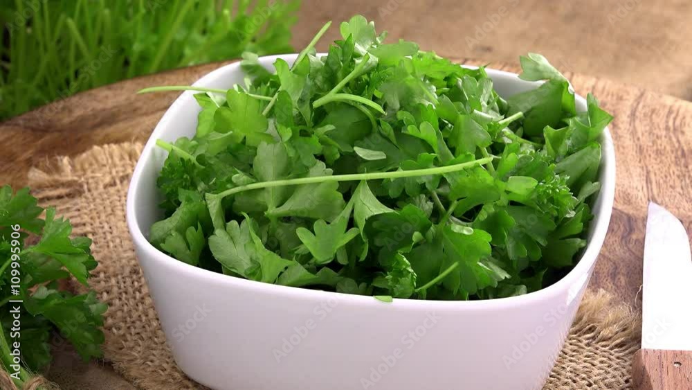 Portion of fresh cutted rotating Parsley as not loopable 4K UHD footage Portion of fresh cutted rotating Parsley as not loopable 4K UHD footage