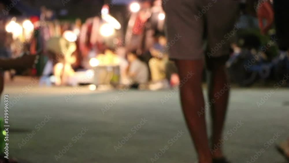 People walking the streets at night People walking the streets at night