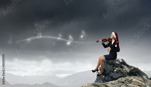 Santa woman play violin