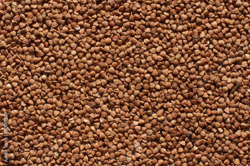Raw brown buckwheat grain background