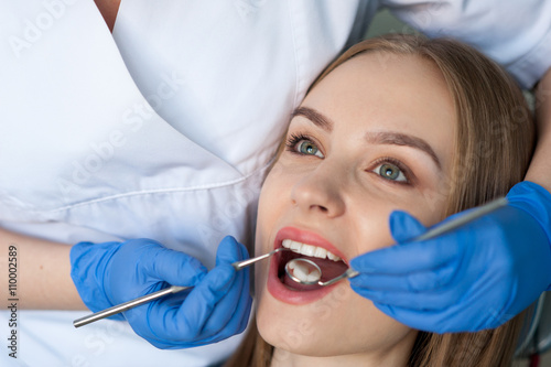 Dentist examining a patient's teeth