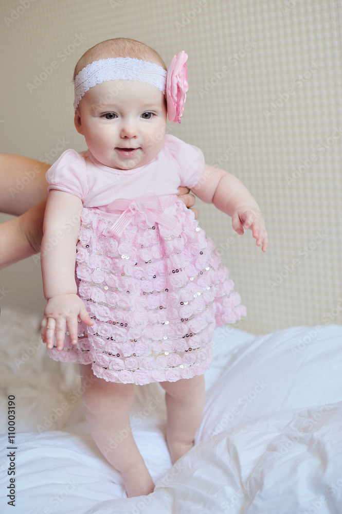 Adorable little baby girl sitting on the floor studio shot lovely portrait Adorable little baby girl sitting on the floor studio shot lovely portrait