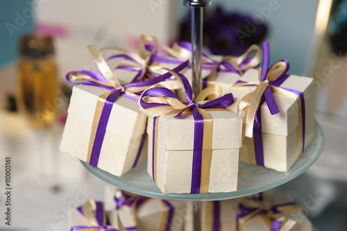 Beautiful bonbonnieres with ribbons staying in a row