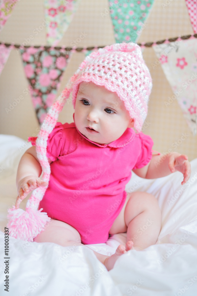 Adorable little baby girl sitting on the floor studio shot lovely portrait Adorable little baby girl sitting on the floor studio shot lovely portrait