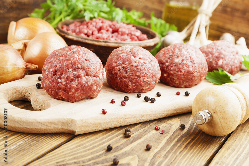 Raw meatballs on the table Raw meatballs on the table