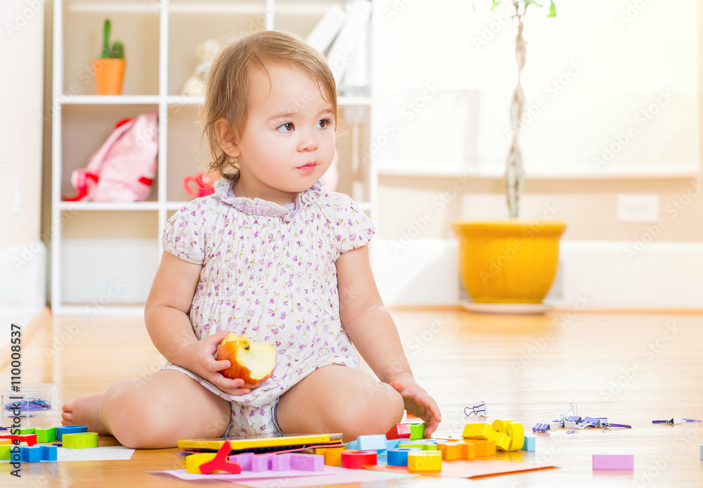 Toddler girl playing with her tablet computer Toddler girl playing with her tablet computer