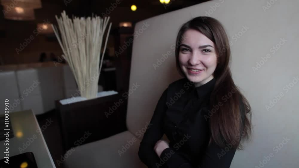 Pretty girl smiling in a cafe Pretty girl smiling in a cafe