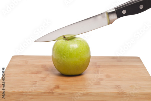 knife cutting apple