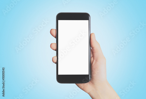 Cellulare in mano schermo acceso  photo