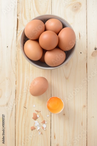 Fresh eggs on wood background. Top view