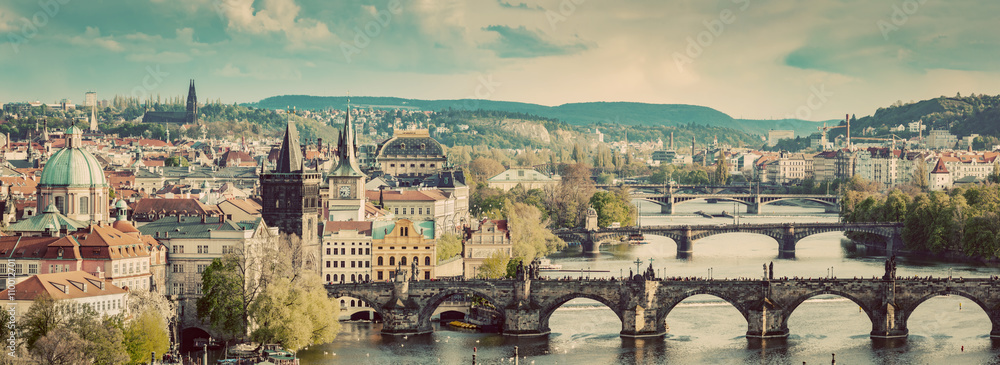 Obraz premium Prague, Czech Republic bridges skyline with historic Charles Bridge and Vltava river. Vintage
