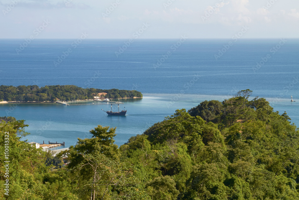 View of a Bay and laguna with a boat in Roatan in Honduras.