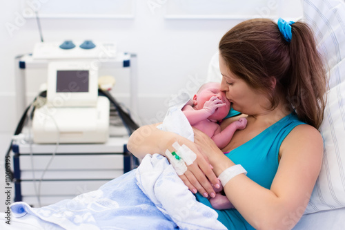 Young mother giving birth to a baby